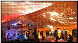 Wedding under a tent with Gobos projected on the under side of the tent and band sound and lighting on stage