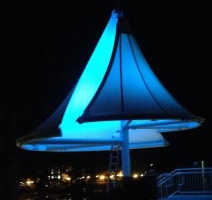 Levitt Pavilion Westport - Fabric structure covering staircase outdoor colored LED lighting at night